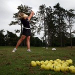 Brooke Henderson practices golf at the driving range