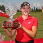 Brooke Henderson holds up a trophy