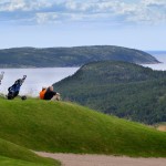 Two golfers looking out into the Atlantic Ocean while playing golf at The View Golf Resort, Newfoundland.