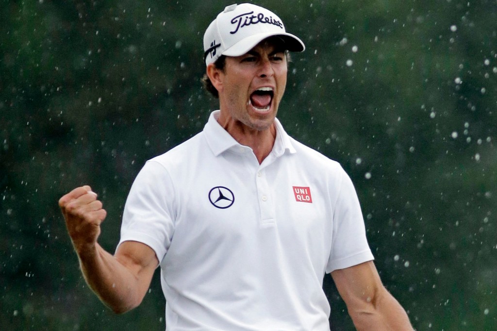 Adam Scott screams and celebrates after holing a putt on the 72nd hole during the 2013 Masters