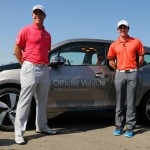 Rory McIlroy and Gary Woodland race in a BMW i3 prior to the 2013 BMW Championship at Conway Farms Golf Club in Illinois