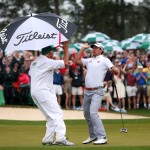 Adam Scott celebrates with Steve Williams after makig a birdie on the 18th hole during the final round of the 2013 Masters to force a playoff.