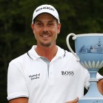 Henrik Stenson holds up the trophy after winning the Deutsche Bank Championship