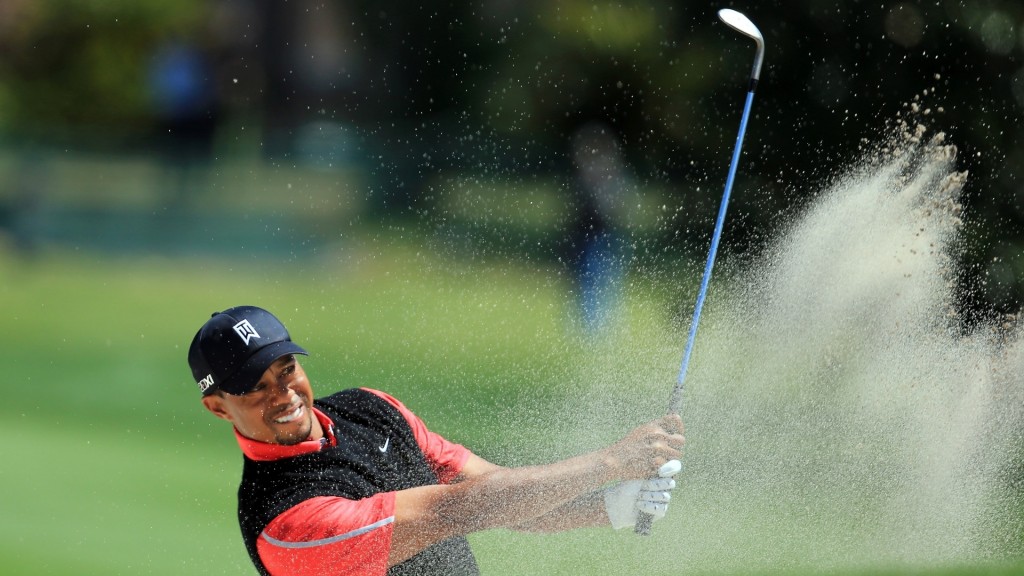 Tiger Woods hitting a bunker shot