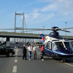 Tiger Woods in Turkey hitting a golf ball on the Bosphorus Bridge, which connects Europe and Asia