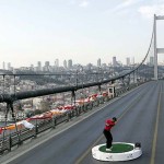 Tiger Woods in Turkey hitting a shot across the Bosphorus Bridge, which connects Europe and Asia