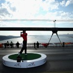 Tiger Woods in Turkey hitting a shot across the Bosphorus Bridge, which connects Europe and Asia