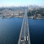 Tiger Woods in Turkey hitting a golf ball on the Bosphorus Bridge, which connects Europe and Asia